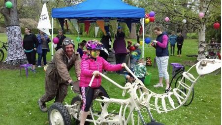 Dinosaur bones bike with a child riding it